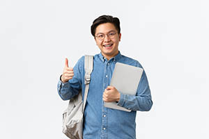 picture of short student man carrying bags over shoulder 